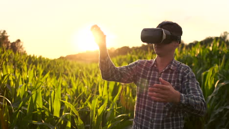 Smart-farming-with-IoT-futuristic-agriculture-concept-:-Farmer-wears-VR-or-AR-glasses-while-monitoring-rainfall-temeprature-humidity-soil-pH-with-immersive-experience-on-digital-holographic-screen.